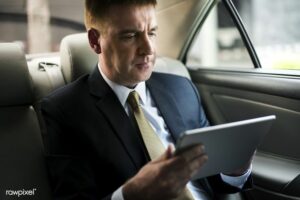 Download Premium Image Of Businessman Using A Tablet In A Car By Teddy About Businessman, Executive, Business Man, Man Laptop, And Business Executives 28188